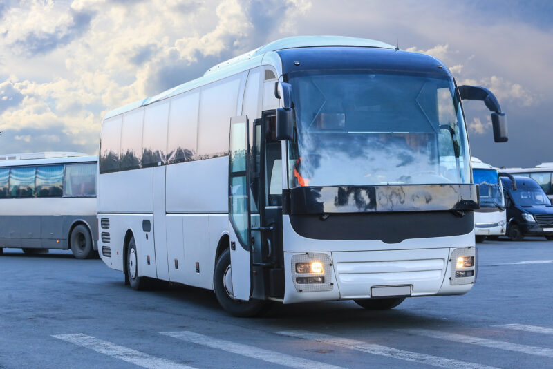 big tourist buses in parking lot